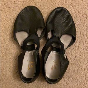 Flat leather dance shoes.